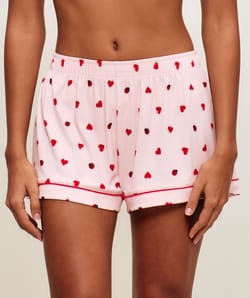 Ribbed jersey shorts with heart and ladybug patterns;