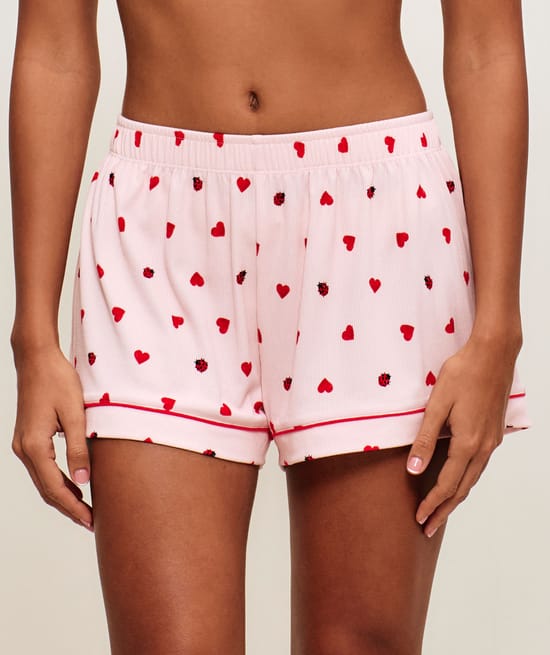 Ribbed jersey shorts with heart and ladybug patterns;