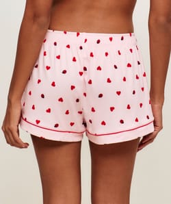 Ribbed jersey shorts with heart and ladybug patterns;