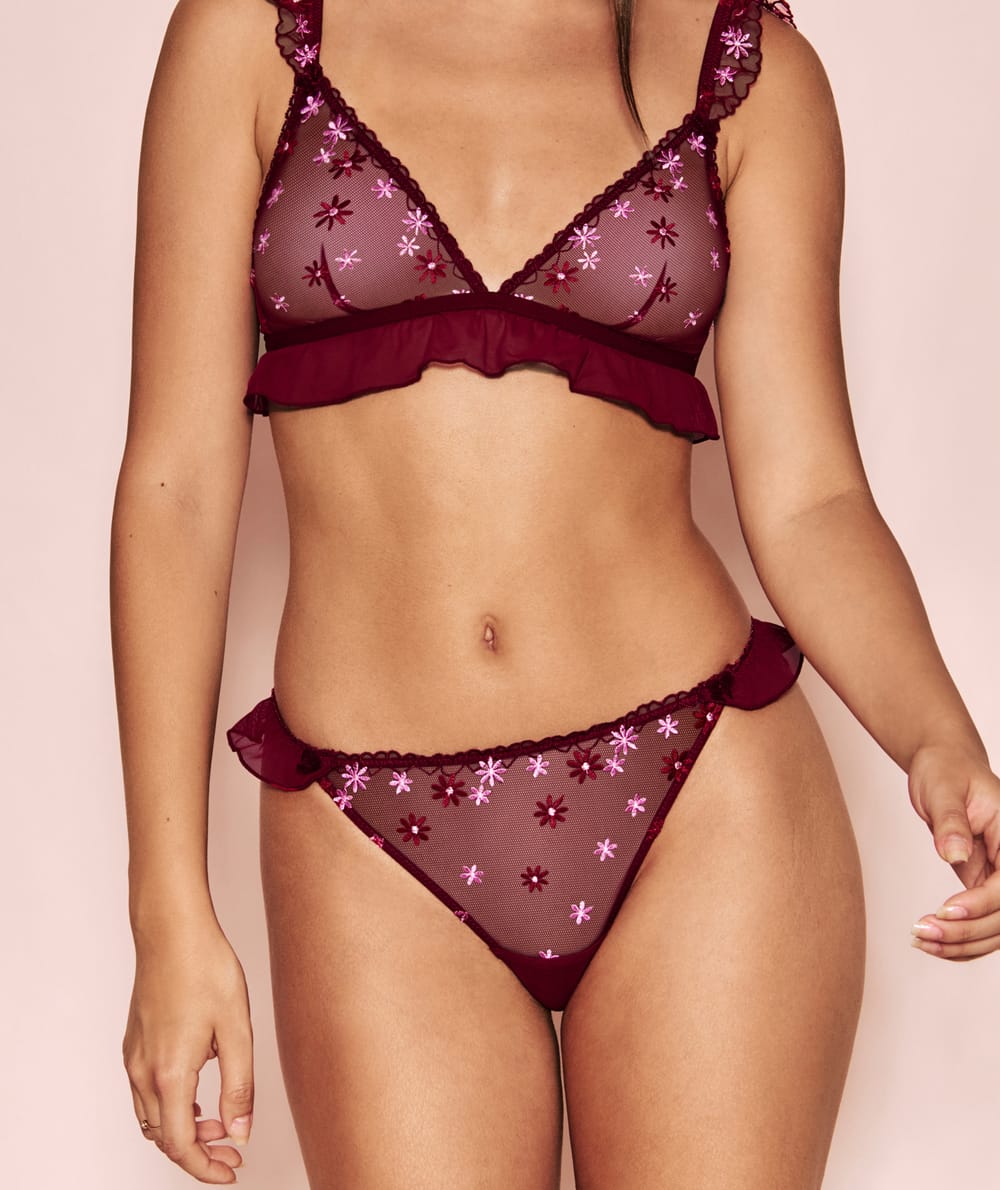 Brief with embroidered floral patterns;
