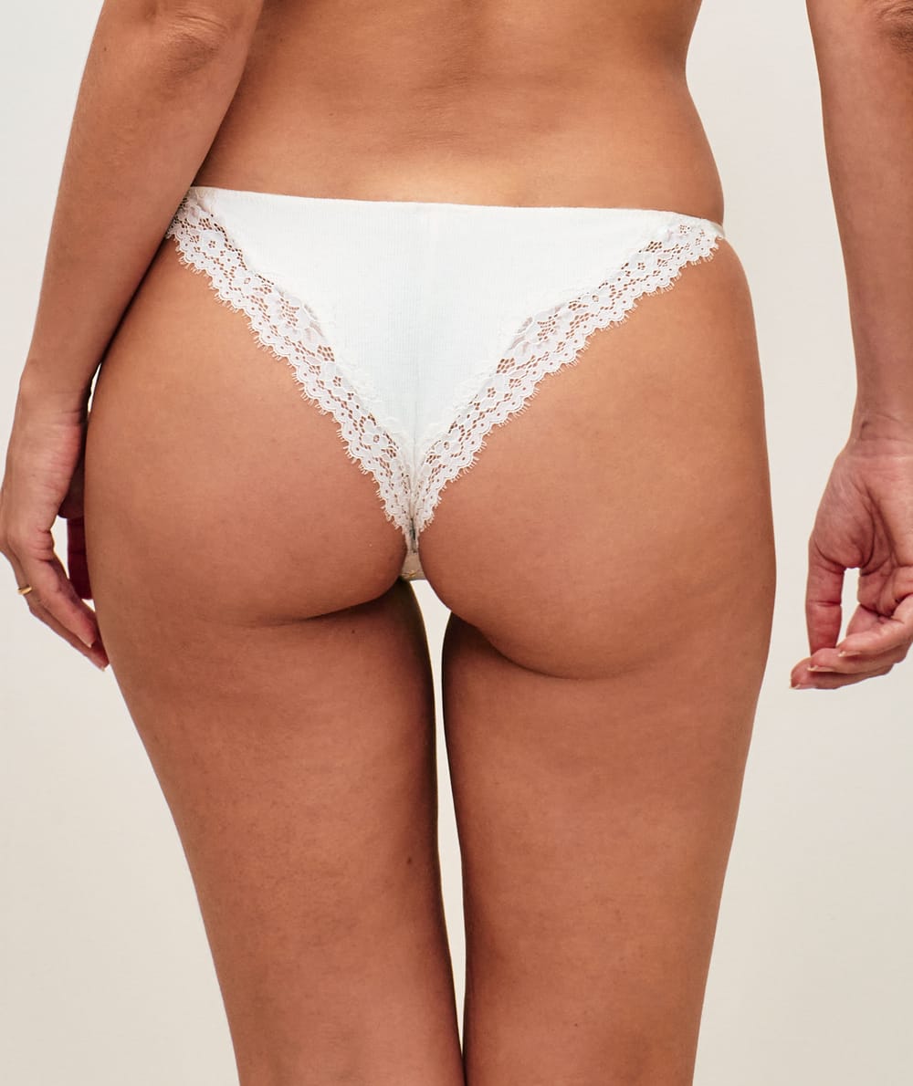 Jersey thong with lace and floral embroidery;