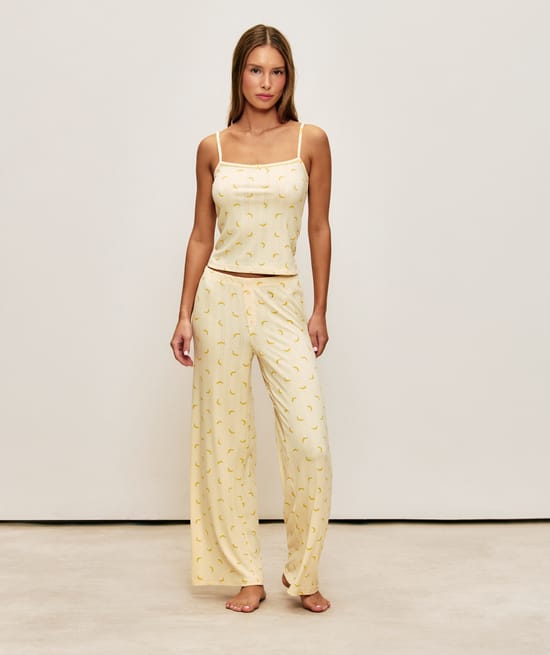 Corduroy jersey pants with banana patterns;