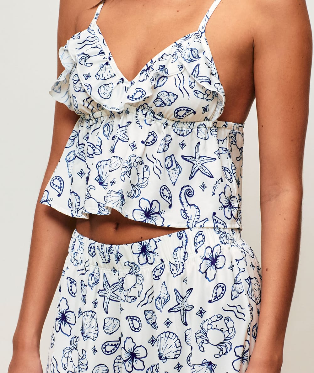 Satin crop top with V-neck, thin straps, and ruffles;