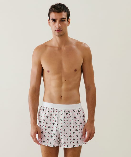 Cotton boxer shorts with holly and heart pattern;