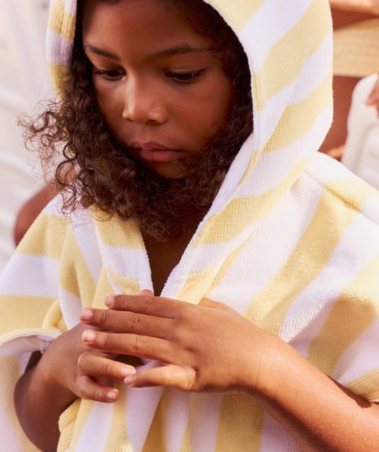 Kinderen poncho met zonnenpatroon;