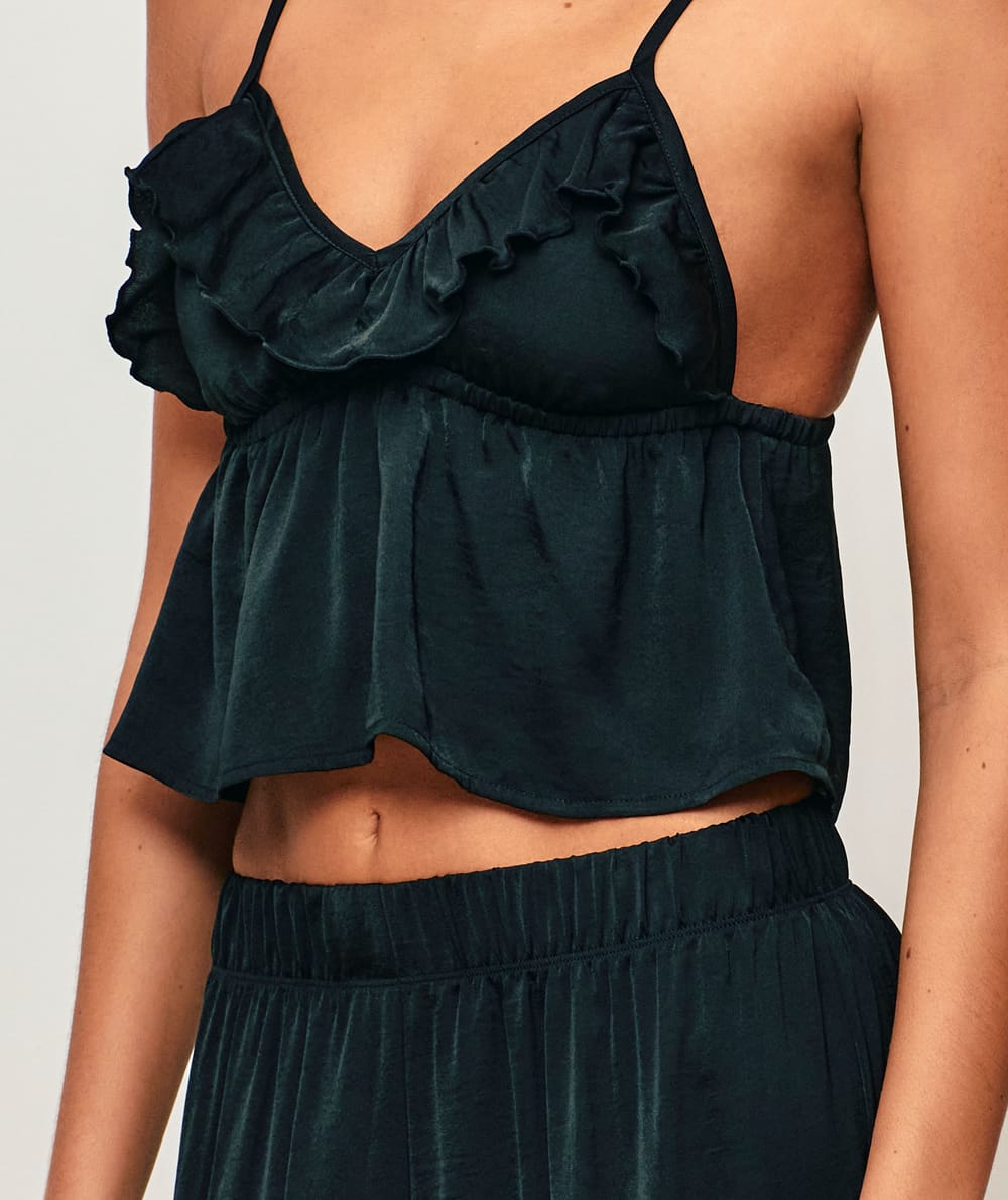 Satin crop top with V-neck, thin straps, and ruffles;