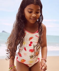 Kids' one-piece swimsuit with fruity and floral pattern;