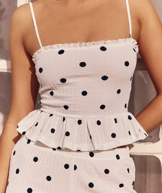 Textured fabric caraco with polka dot patterns;