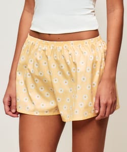Cotton shorts with floral patterns;
