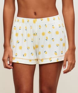 Short en jersey c&ocirc;tel&eacute; avec motifs soleils et citrons ;