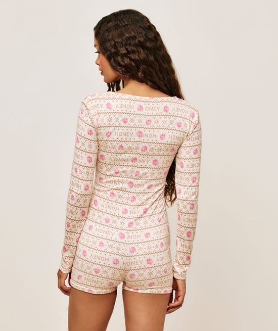 Jersey playsuit with floral patterns;