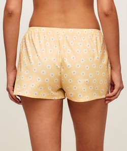 Cotton shorts with floral patterns;