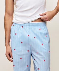 Striped trousers with heart pattern;