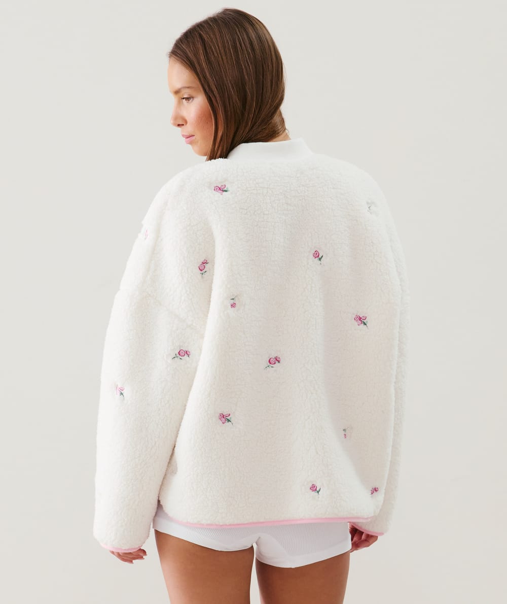 Fleece jacket with embroidered floral patterns;