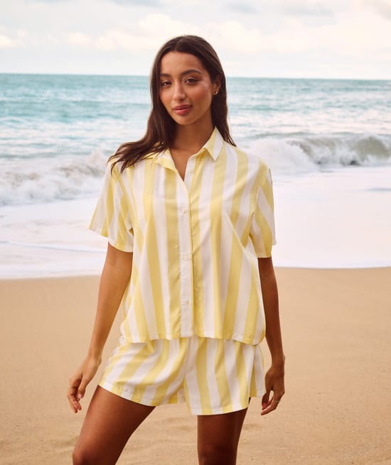 Short sleeve shirt and striped print shorts;