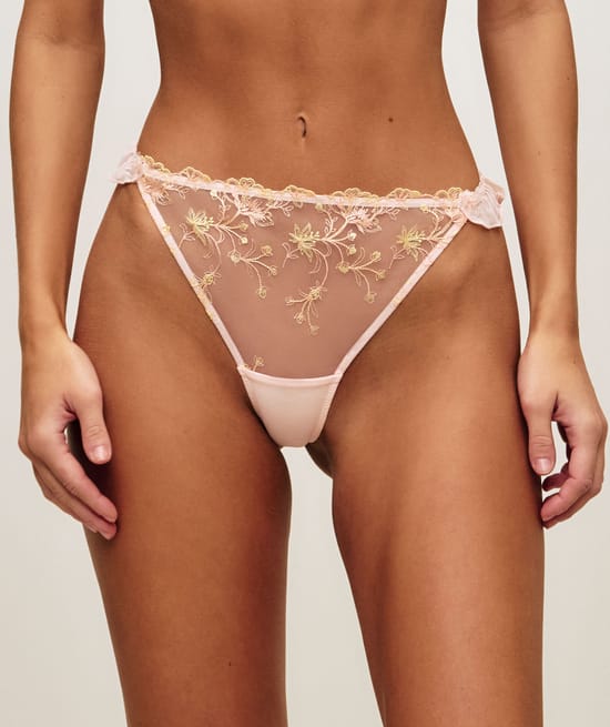 Mesh string with ruffled floral embroidery;