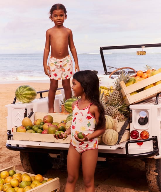Kids' one-piece swimsuit with fruity and floral pattern;