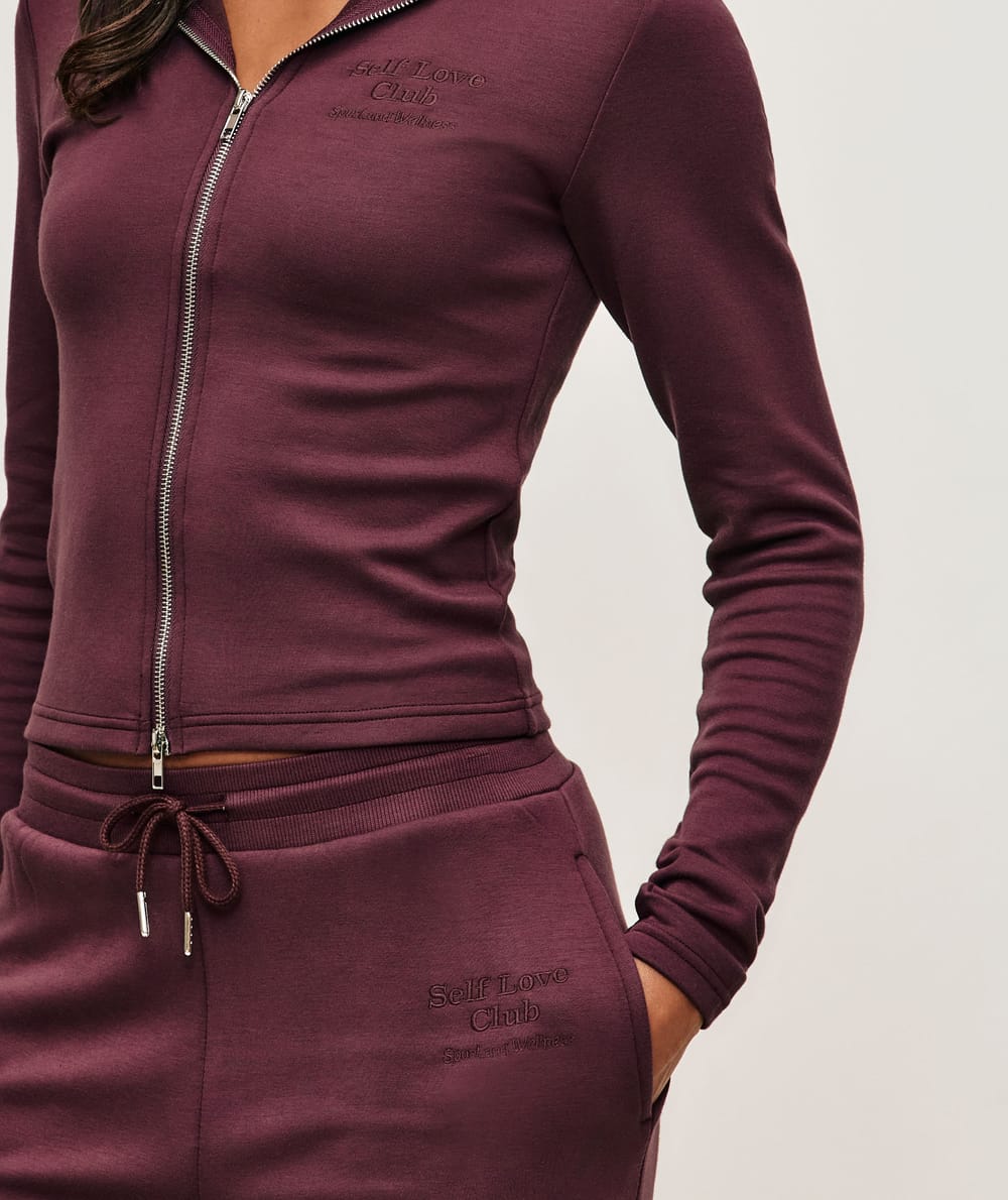 Jacket with Self Love Club embroidery;