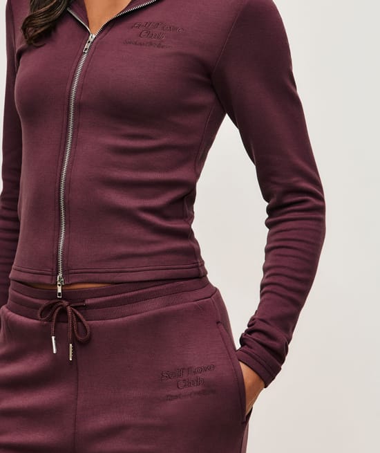 Jacket with Self Love Club embroidery;