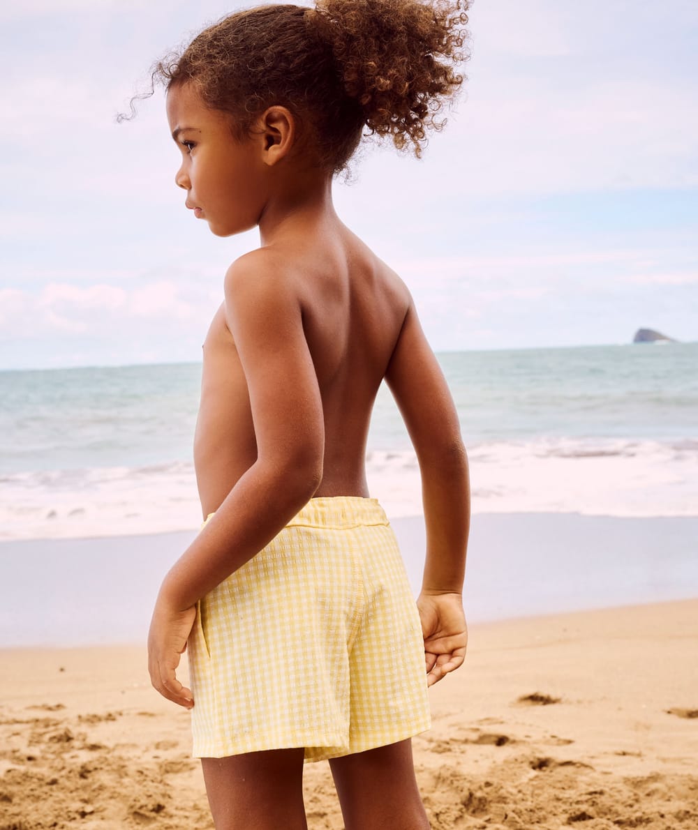 Shorty swimwear with embossed gingham pattern;