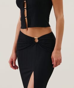 Long skirt with gold ring;