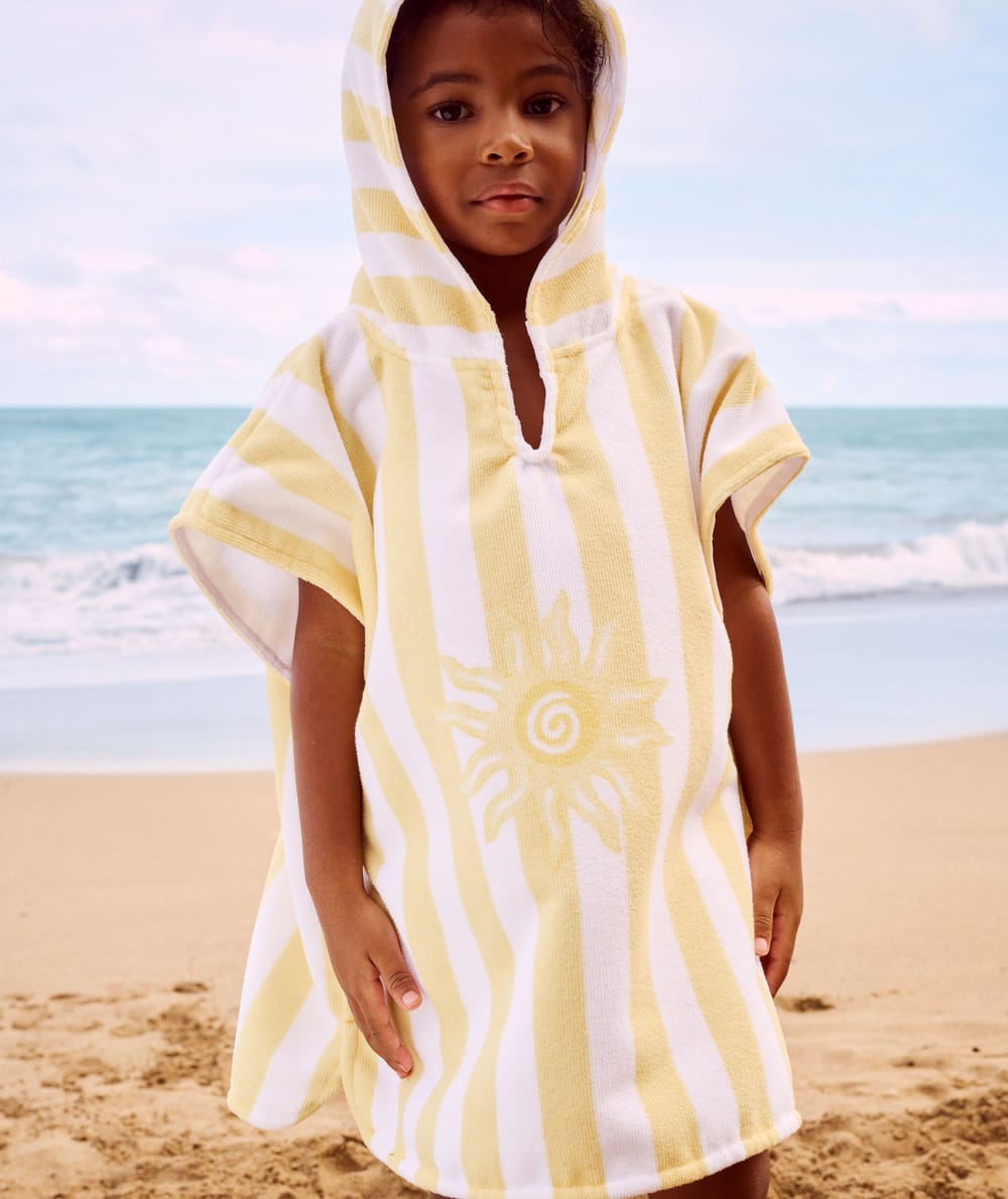 Kinderen poncho met zonnenpatroon;