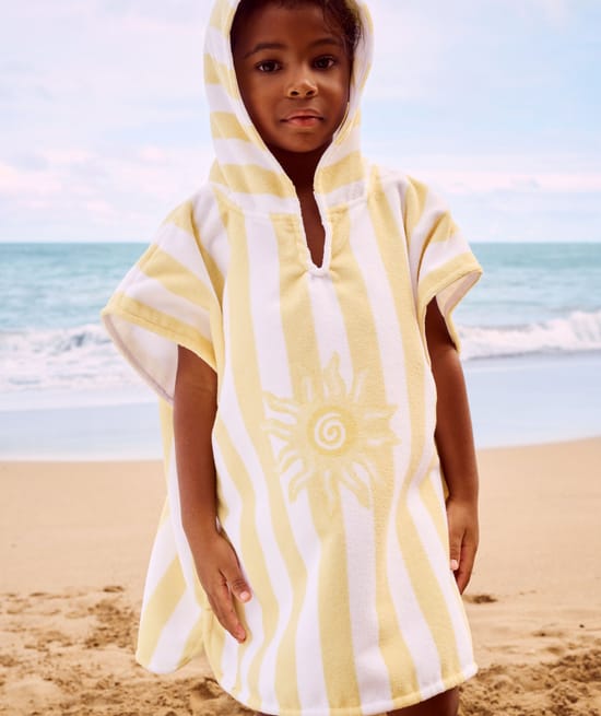 Kinderen poncho met zonnenpatroon;