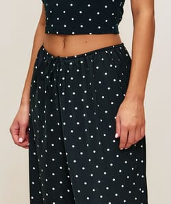 Polka dot satin balloon trousers;