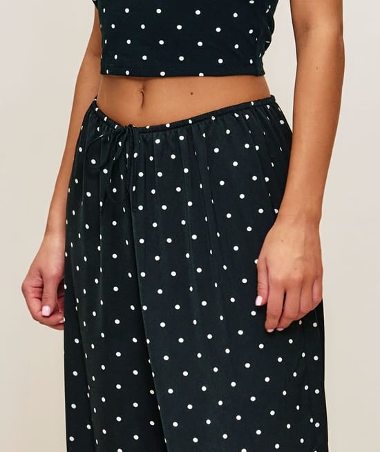Polka dot satin balloon trousers;