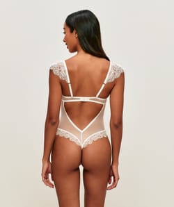 Lace backless bodysuit with shoulder pads;