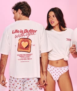 Oversized cotton T-shirt with embroidered motifs and messages;