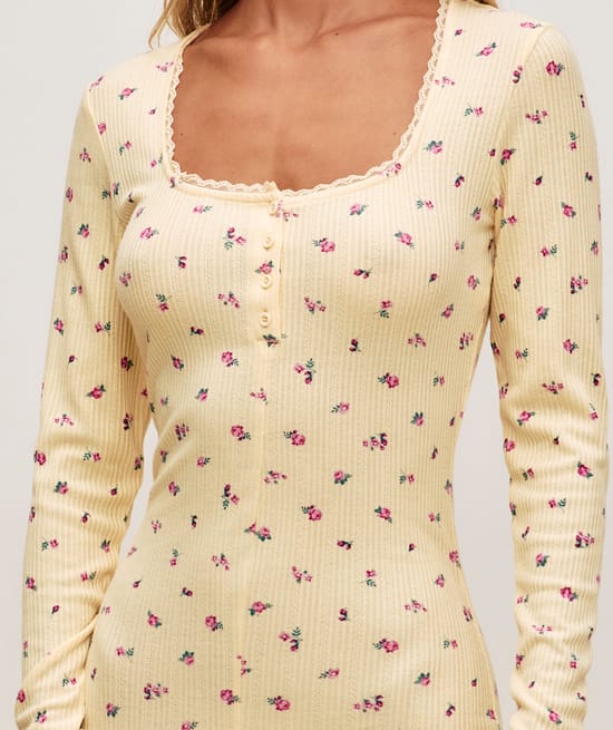 Floral knitted playsuit;