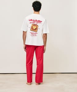 Oversized cotton T-shirt with embroidered motifs and messages;