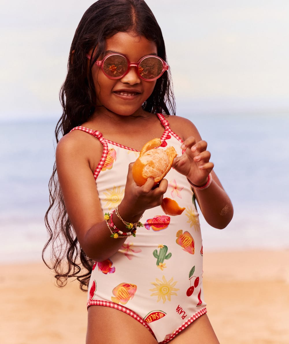 Kids' one-piece swimsuit with fruity and floral pattern;