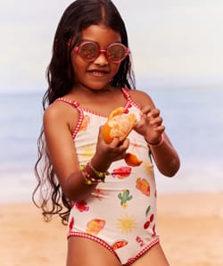 Kids' one-piece swimsuit with fruity and floral pattern;