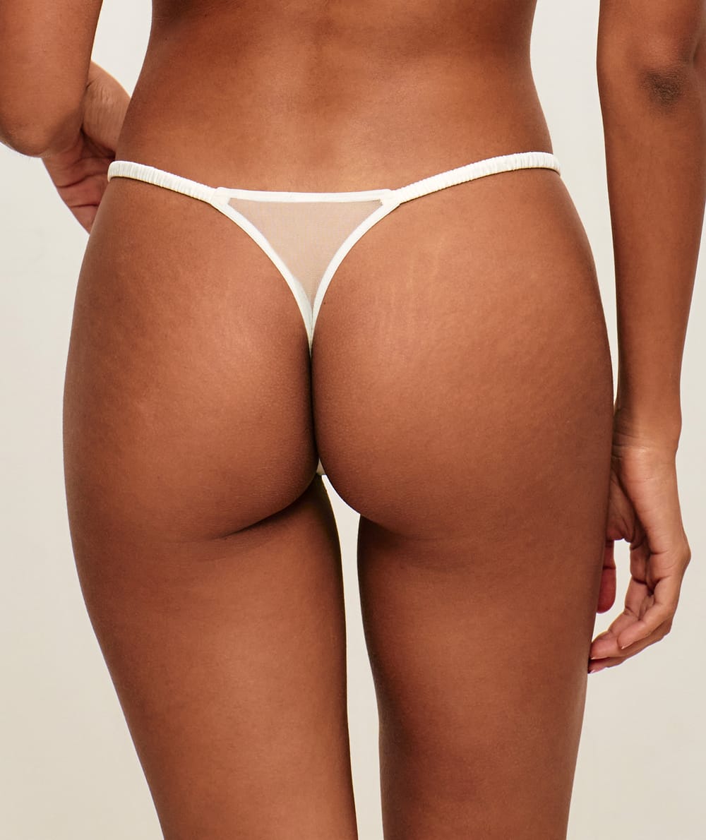 Mesh string with floral embroidery;