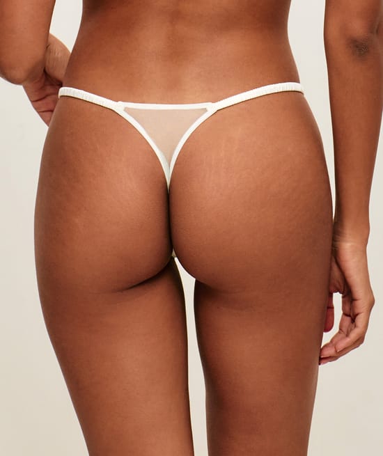 Mesh string with floral embroidery;