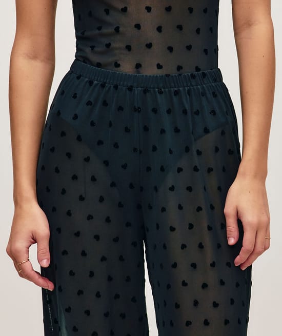 Heart pattern mesh trousers;