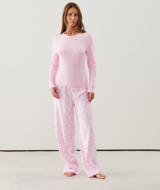 Flannel trousers with stripes and heart patterns;