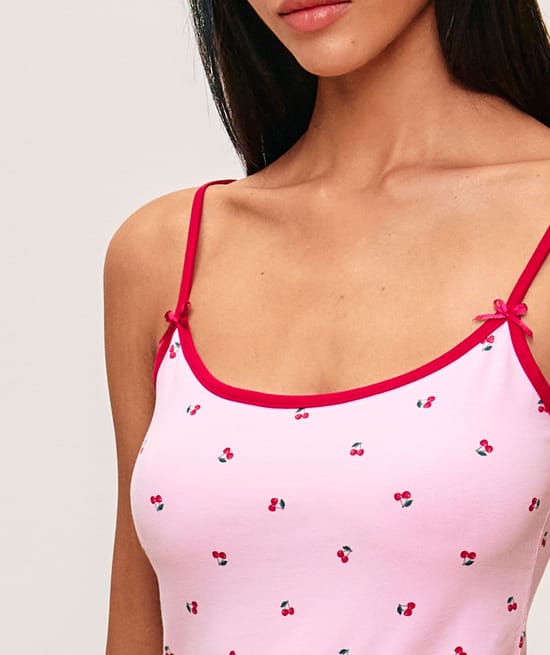 Tank top with adjustable straps featuring a cherry pattern;