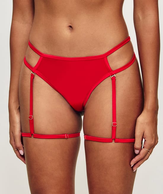 Lace and satin thong and suspender belt;