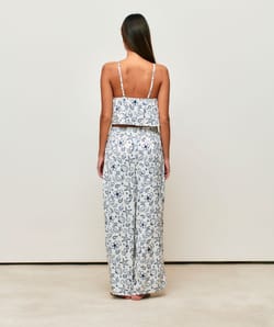 Satin crop top with V-neck, thin straps, and ruffles;