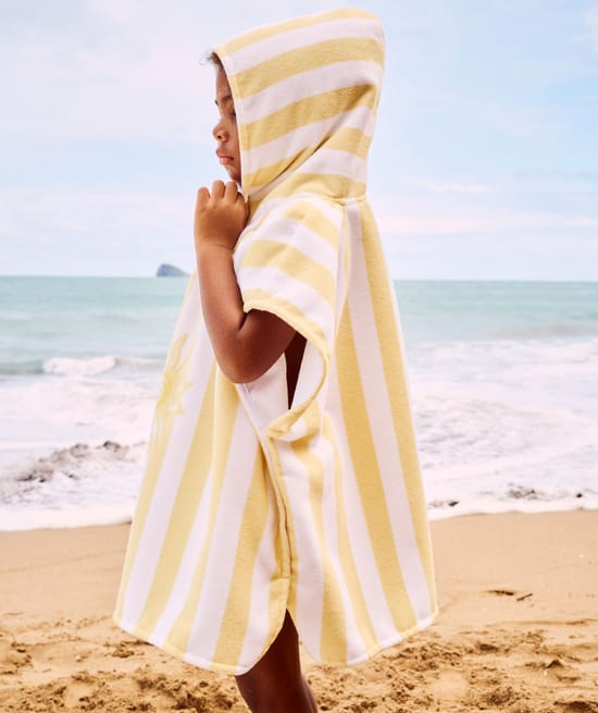 Kinderen poncho met zonnenpatroon;