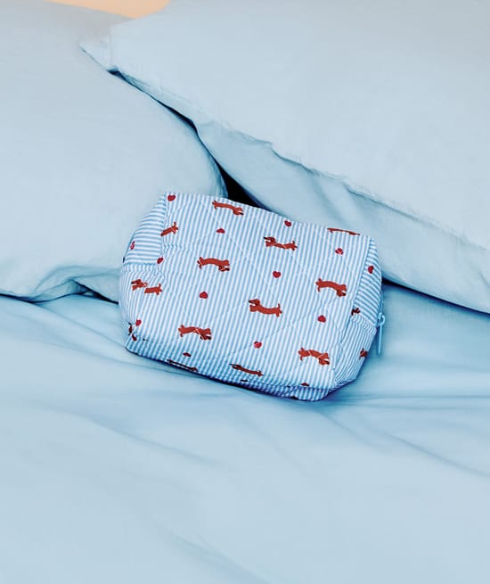 Padded pouch with striped and dachshund print;