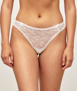 String in floral lace with two small bows;