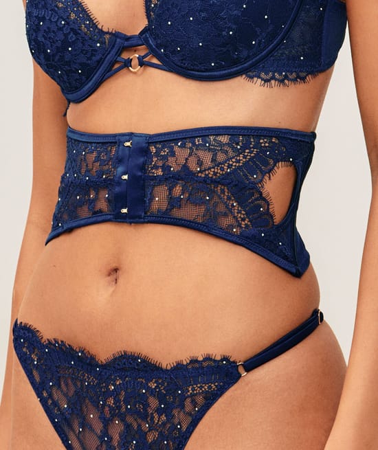 Satin and lace corset with silver rhinestones;