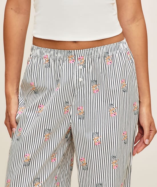 Striped trousers with bear print;