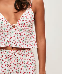 Light poplin top with strawberry and ladybug patterns;