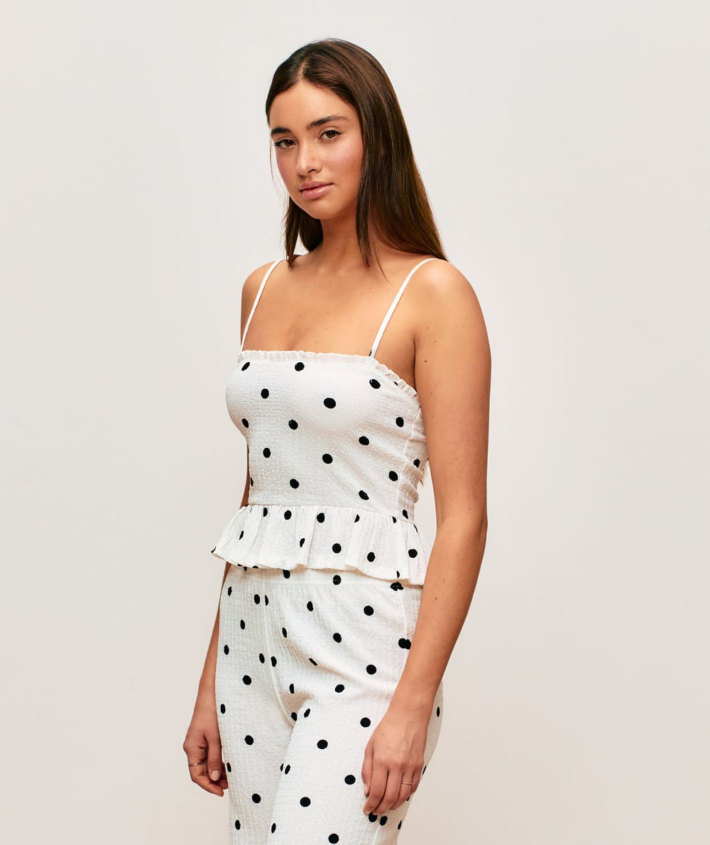 Textured fabric caraco with polka dot patterns;