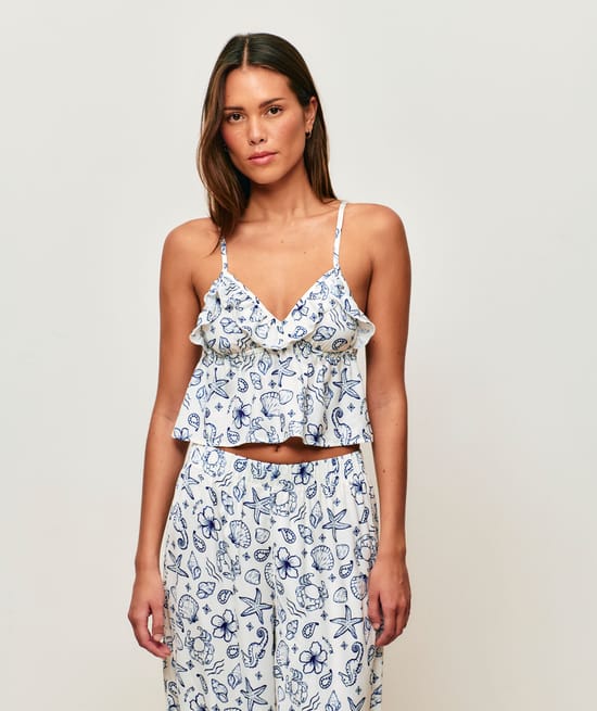 Satin crop top with V-neck, thin straps, and ruffles;